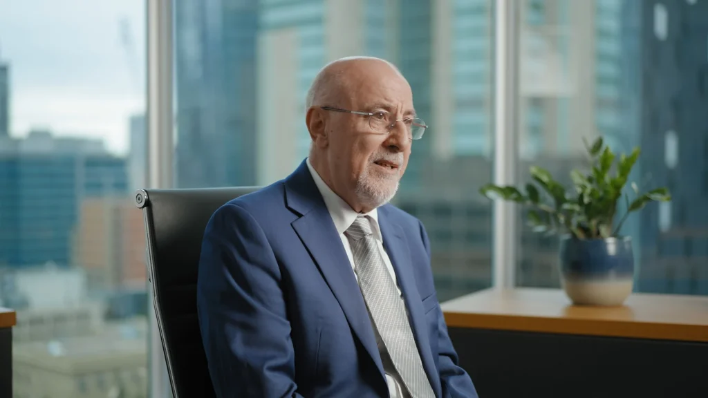 A person is interviewed as part of a company culture video in an office in Calgary.
