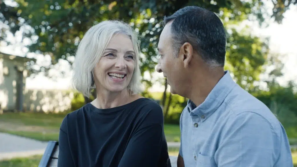 Two people talk during a new testimonial video in Calgary.