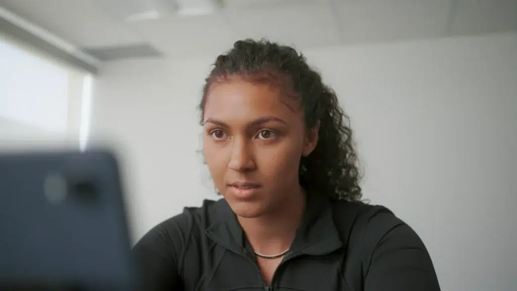 A person looks at a computer while learning as part of an educational video.
