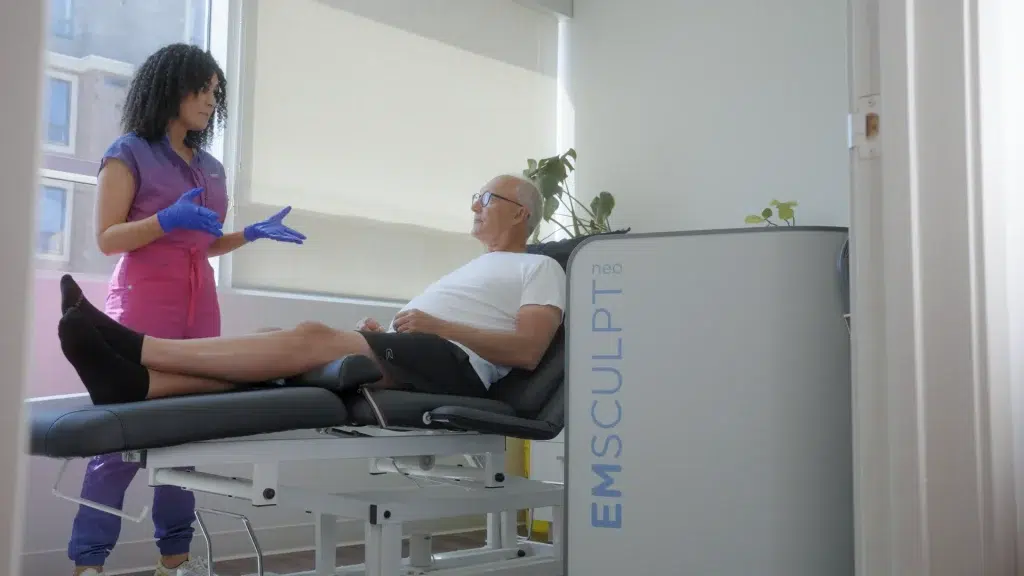 A person explains a medical service to a client during an educational video recording.