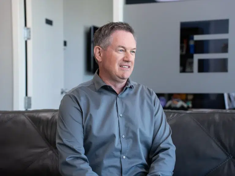 A team member gives a testimonial during an internal communications video.