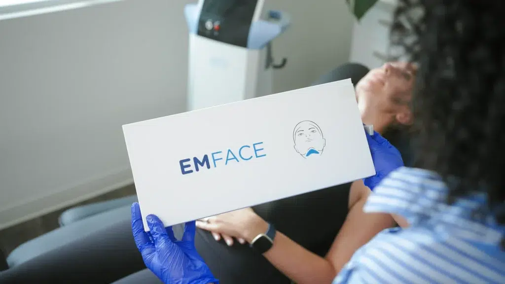 A technician holds a product box before a treatment during a corporate video in Calgary.