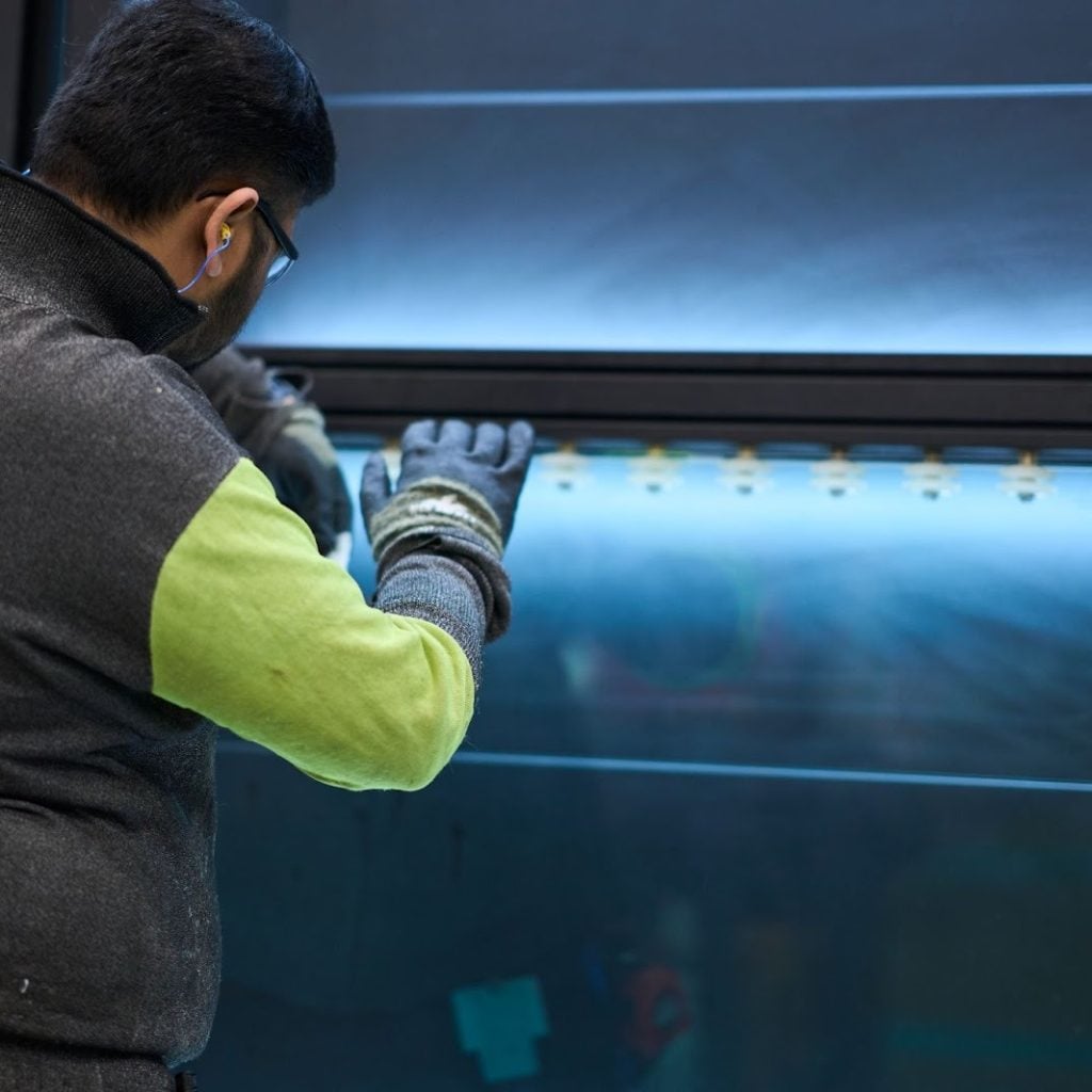 A team member works in a warehouse during an internal communications video.