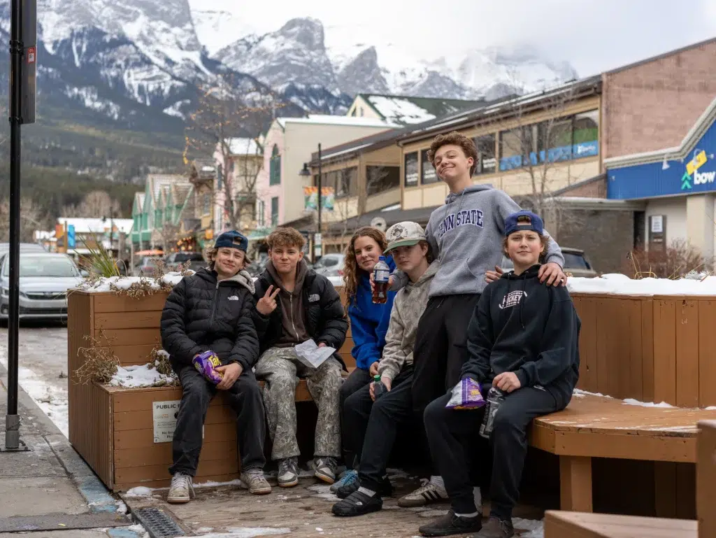A group of teenagers poses for the camera during a video shoot in Banff, Alberta.