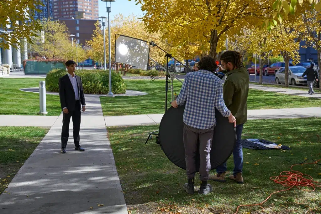 A videography crew test the lighting during an ad for a corporate client.