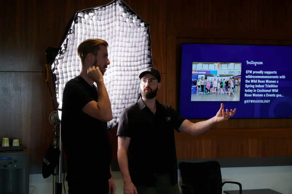 A person explains a video strategy to a client using a presentation.